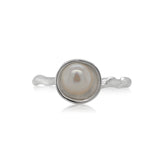 Silver ring with a pearl on a white background